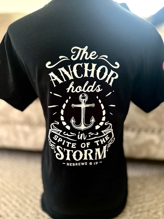Black t-shirt with white anchor design and text on the back, worn by a person.